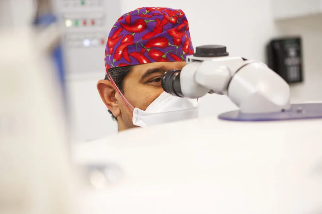Consultant surgeon looking performing eye surgery at Centre for Sight Sheraz Daya