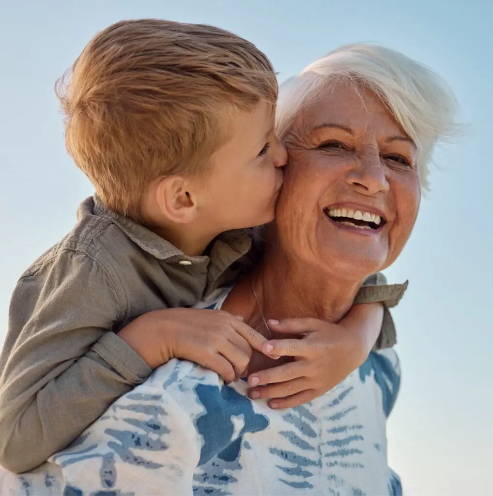 Centre for Sight patient with their grandchildren smiling after vision correction