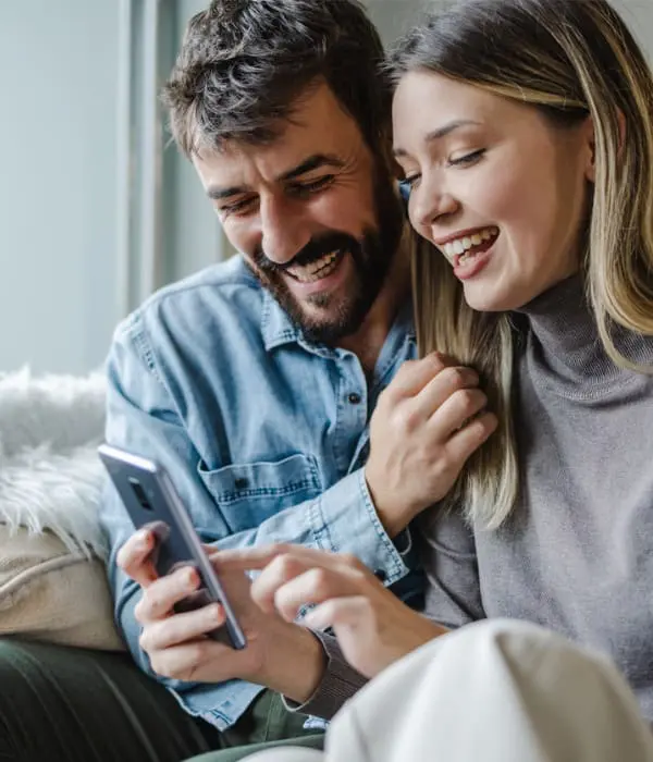 Couple looking at mobile phone