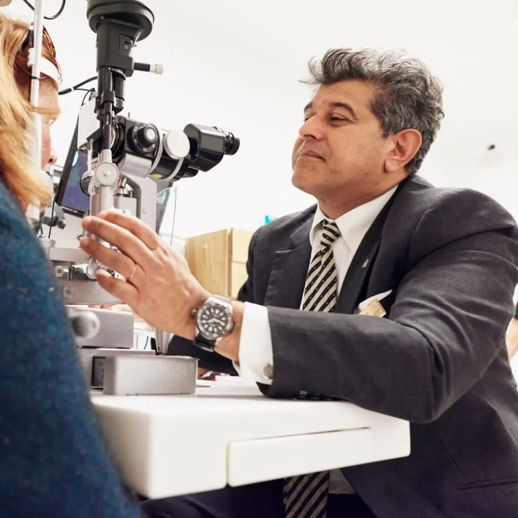 Centre for Sight Sheraz Daya looking at patients eyes and tested Medical Director