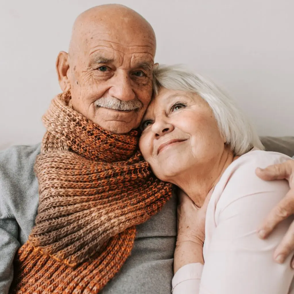Centre for Sight elderly couple sitting on sofa cuddling halos and glare symptoms of cataract stock image