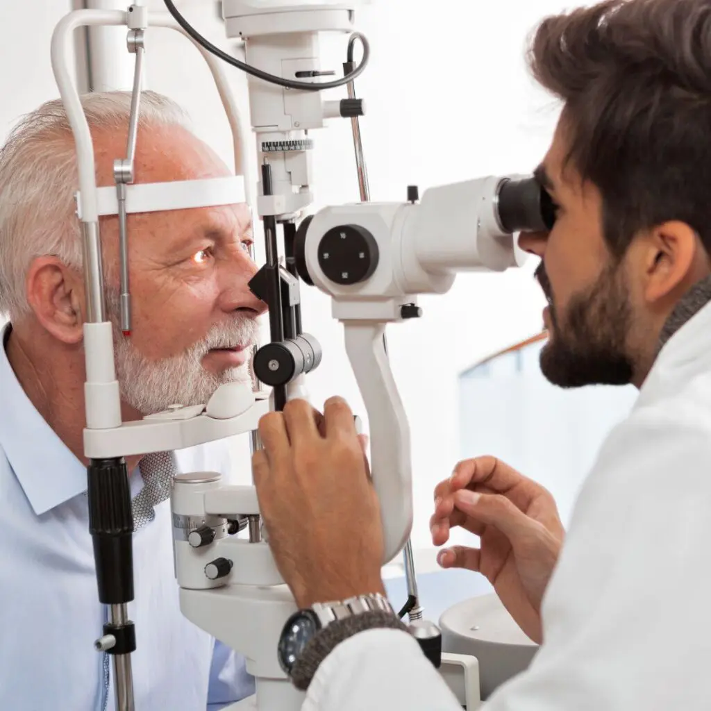 Centre for Sight elderly man having eyes tested at opticians