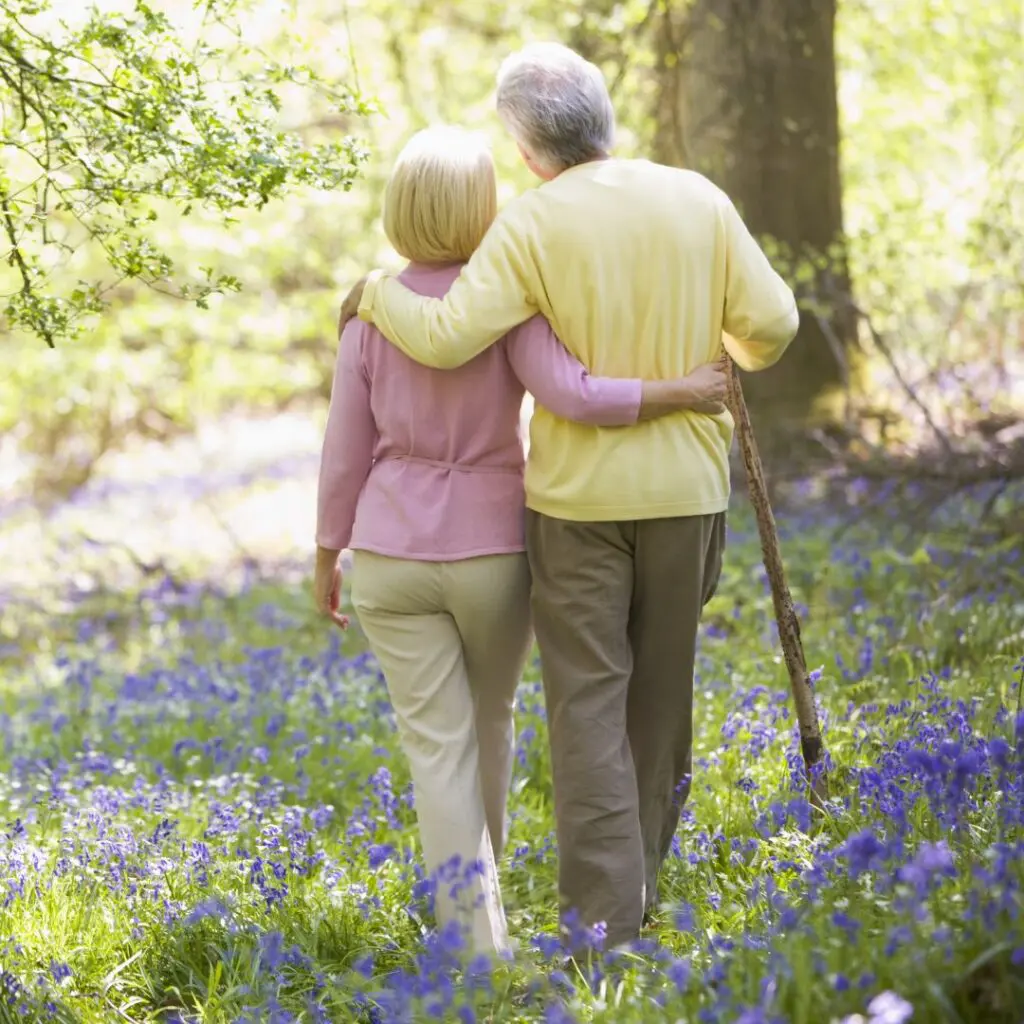 Centre for Sight What are the Symptoms of Fuchs' Endothelial Dystrophy? couple walking through woods
