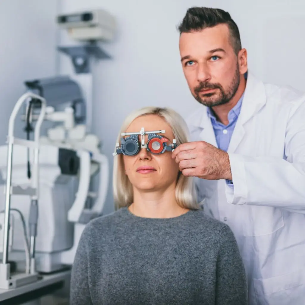 Blonde haired woman wearing grey jumper having eyes being to discover red eye causes