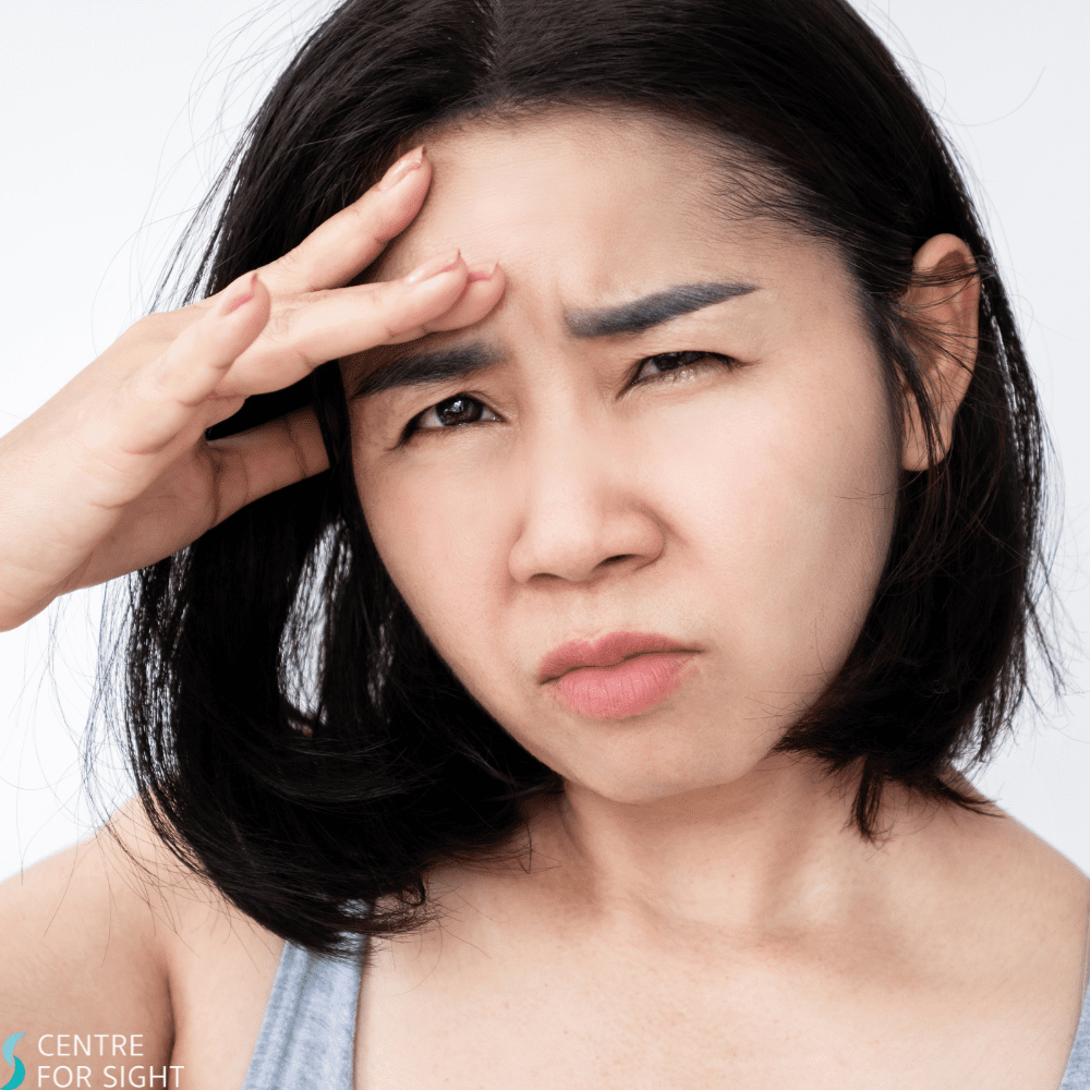 Stock image of woman squinting due to photophobia eye issues