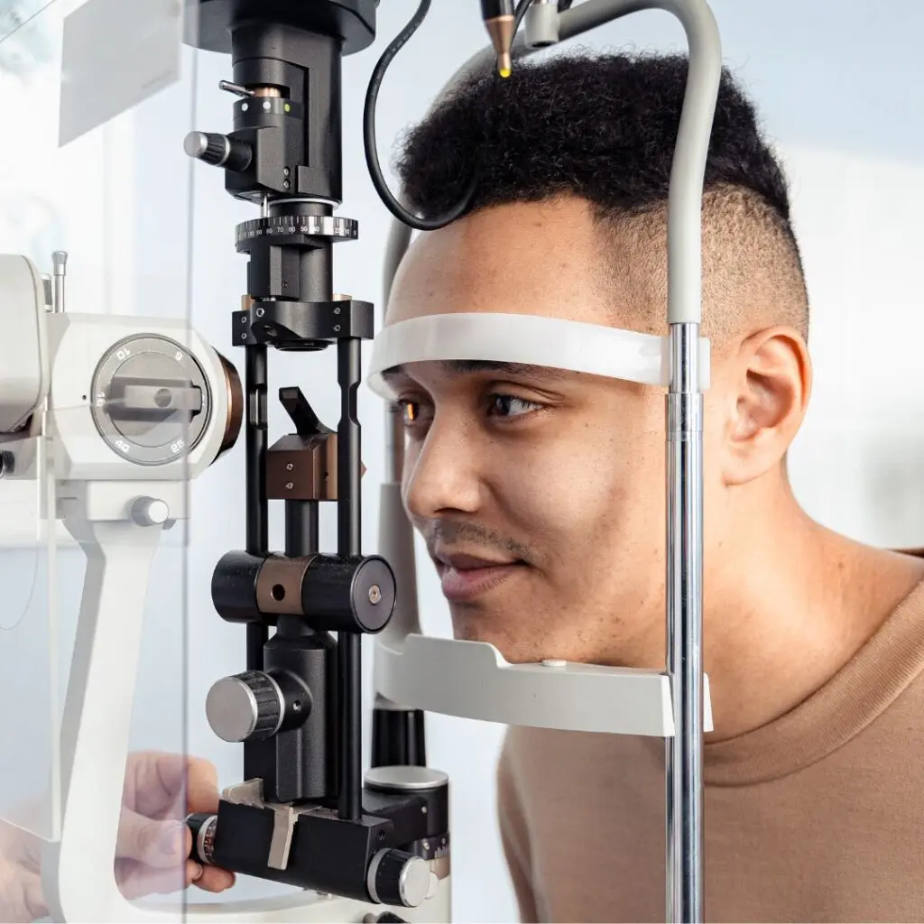 Centre for Sight Man having eyes tested at ophthalmology clinic dark hair chin on chin rest stock image for 10 tips for laser eye surgery patients