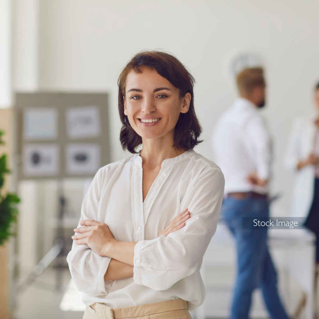 Young lady smiling in studio wearing white shirt
