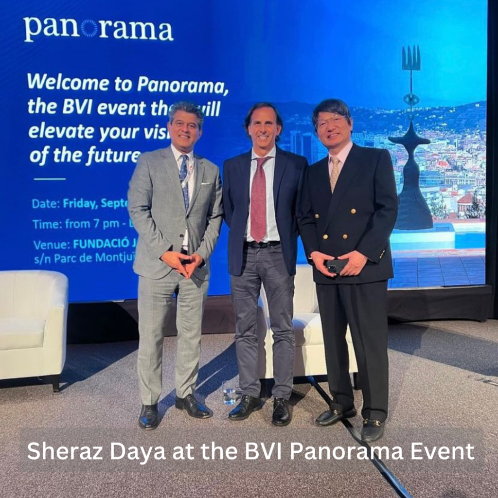 Three professional men on stage having photograph taken in front of Panorama screen smiling