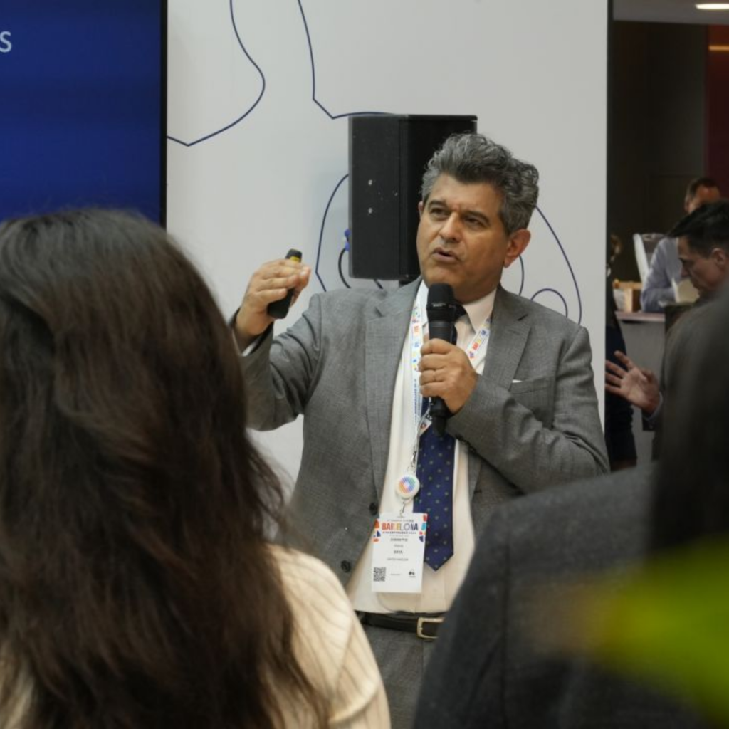 Sheraz Daya, Medical Director of Centre for Sight Private Eye Hospital speaks into microphone presenting at Serenity Launch in Barcelona