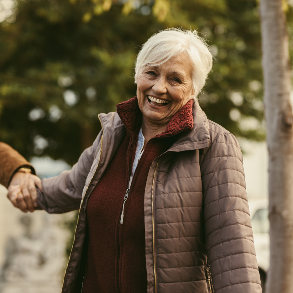 Elderly Lady Walking Holding Hand Smiling