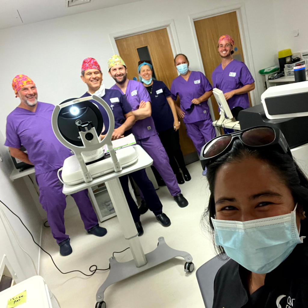 Staff at Centre for Sight a private eye clinic standing around smiling next to a DSLT laser machine for Glaucoma treatment