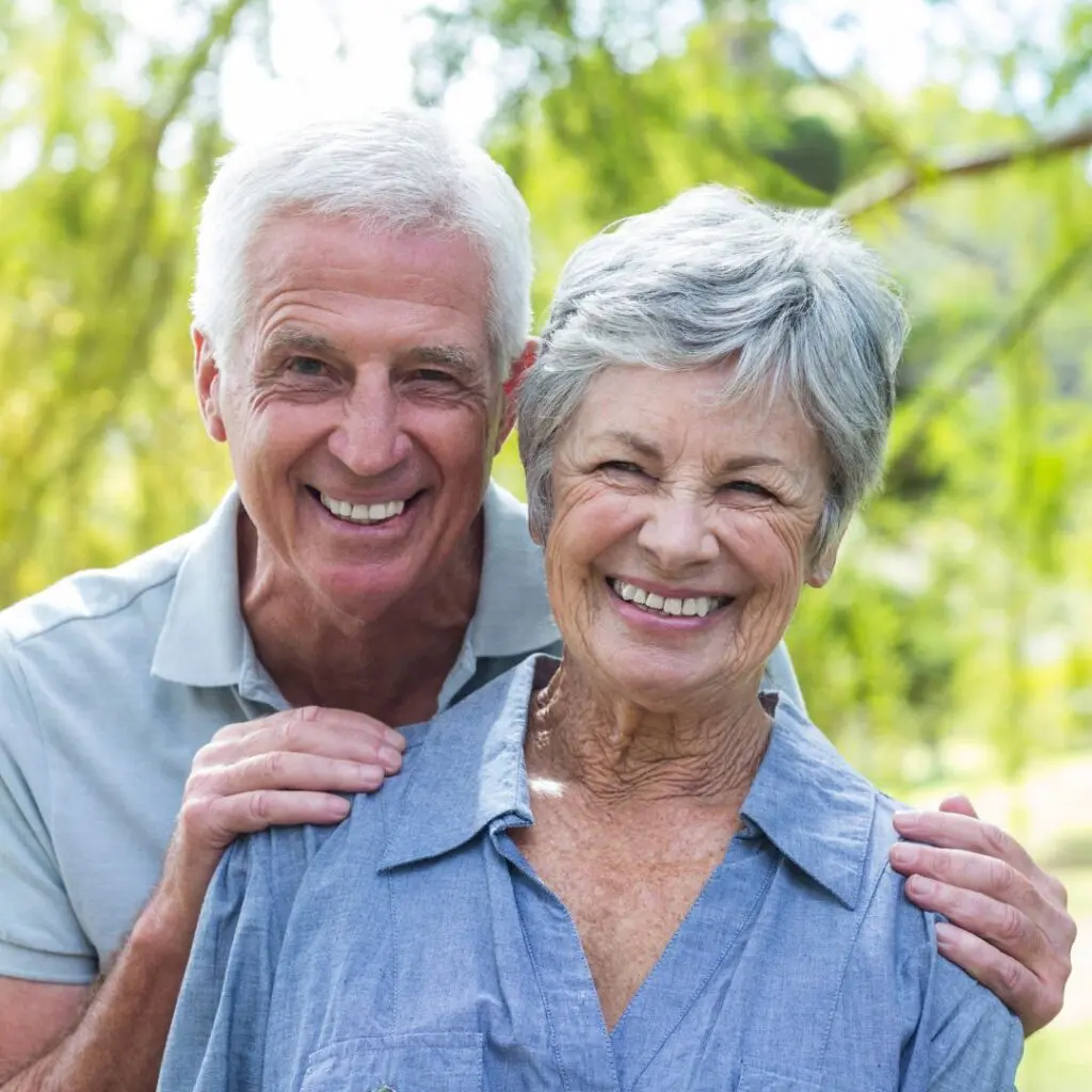 Centre for Sight AMD age related macular degeneration study blog post elderly couple man and woman smiling at camera outside with mans hands on woman's shoulders omega 3
