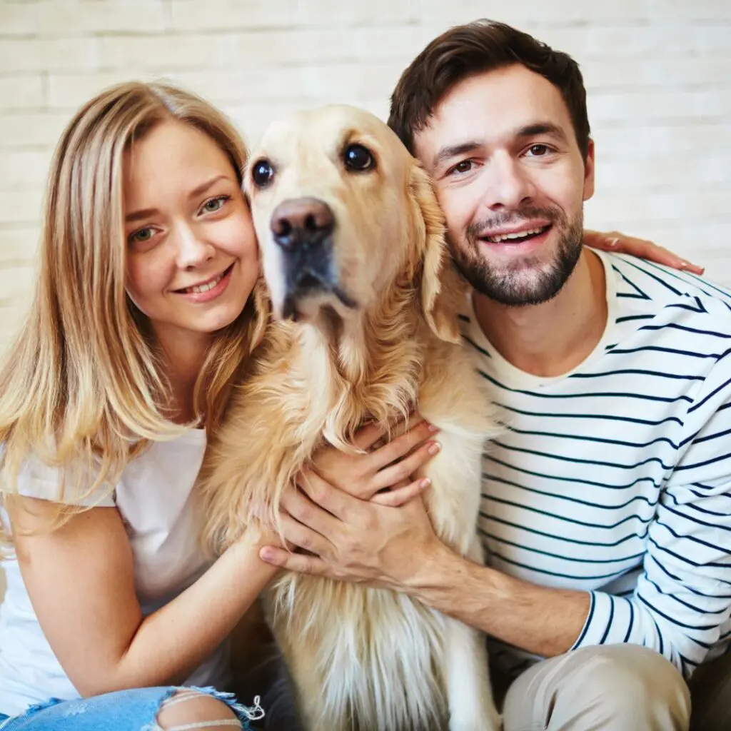 Centre for Sight couple cuddling dog after laser eye surgery guildford