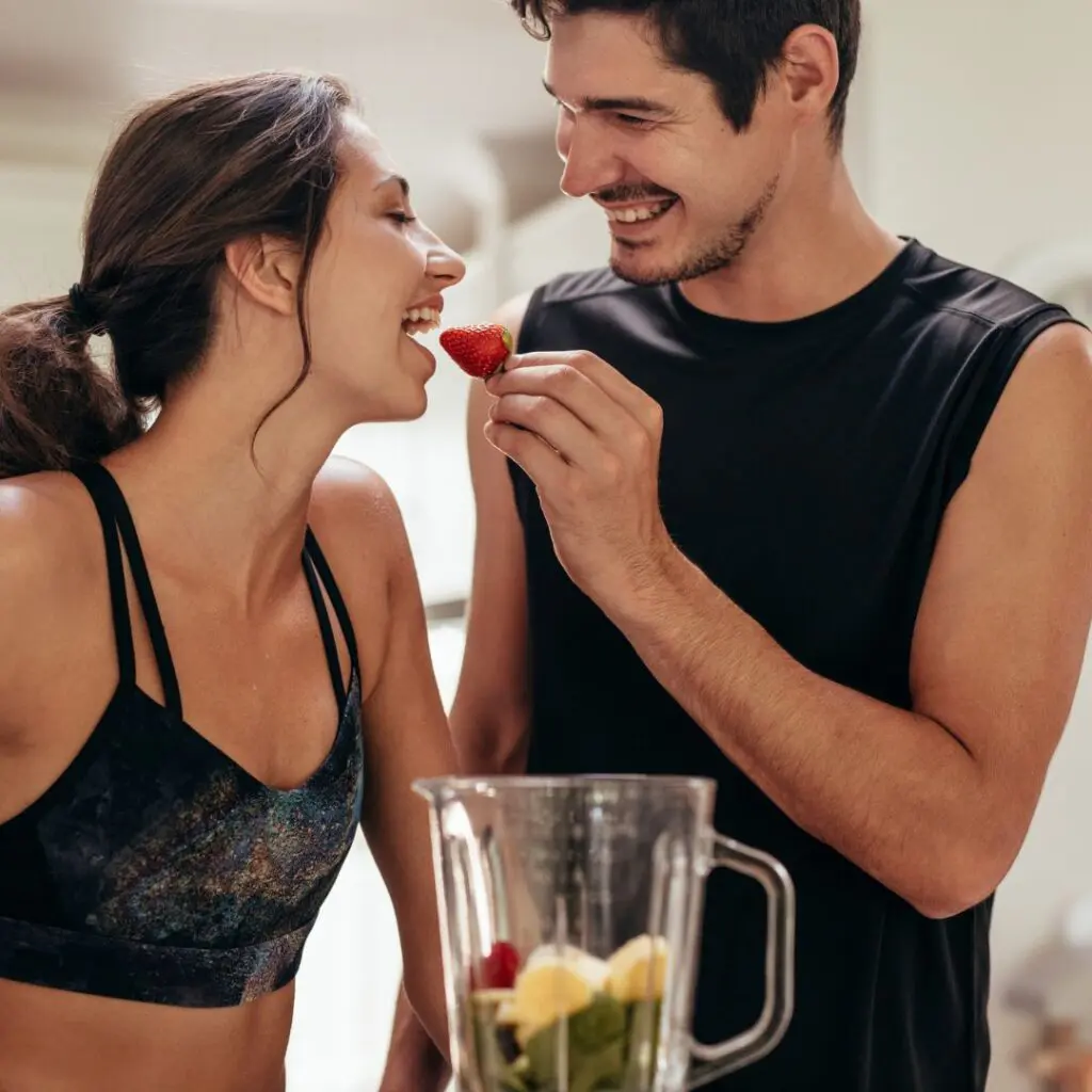 Centre for Sight couple sharing food in gym wear after laser eye surgery woking