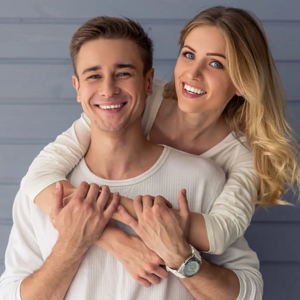 Centre for Sight young couple cuddling and smiling after laser eye surgery tunbridge wells