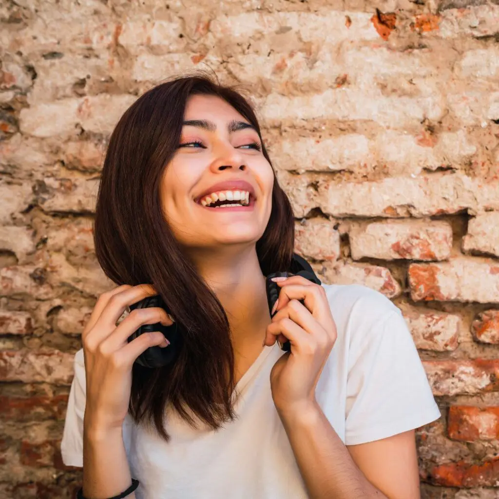Centre for Sight lady smiling against wall brunette dark hair
