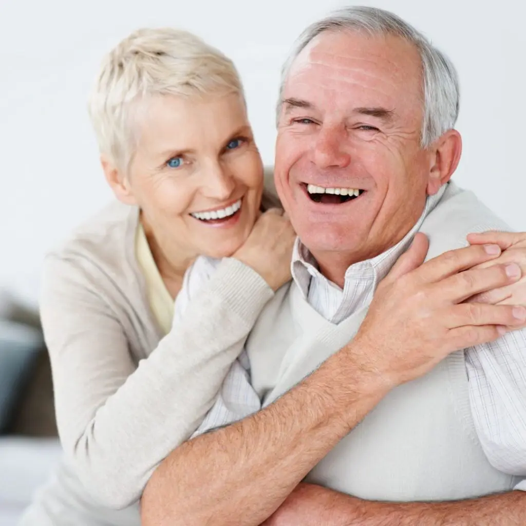 Centre for Sight elderly couple hugging after ELIOS Vision Laser Treatment