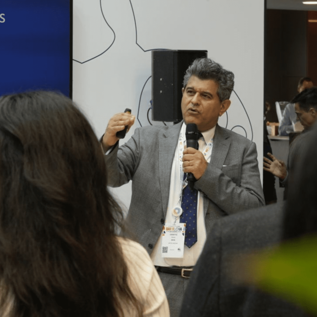 Sheraz Daya, Medical Director of Centre for Sight Private Eye Hospital speaks into microphone presenting at Serenity Launch in Barcelona