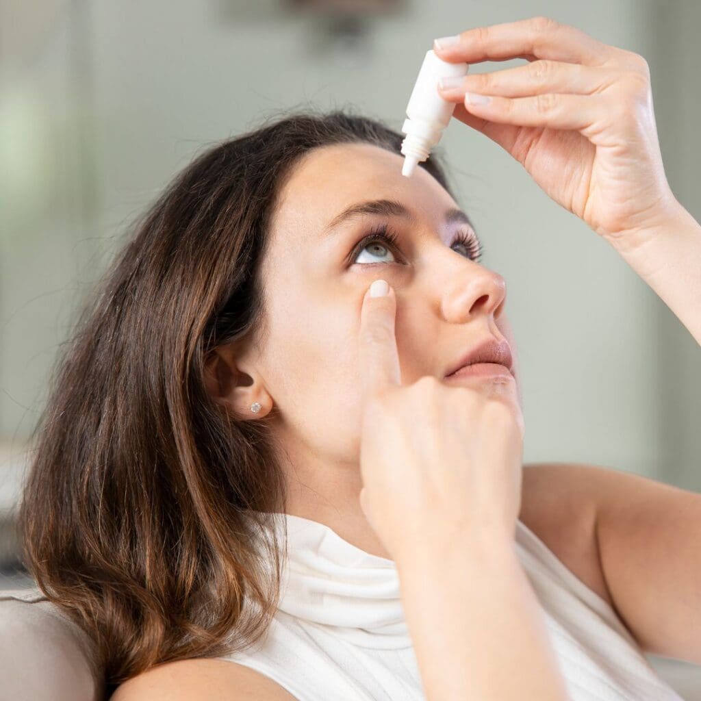 Centre for Sight stock image dry eye woman eye drops brunette who is NOT suitable for laser eye surgery blog post by Sheraz Daya