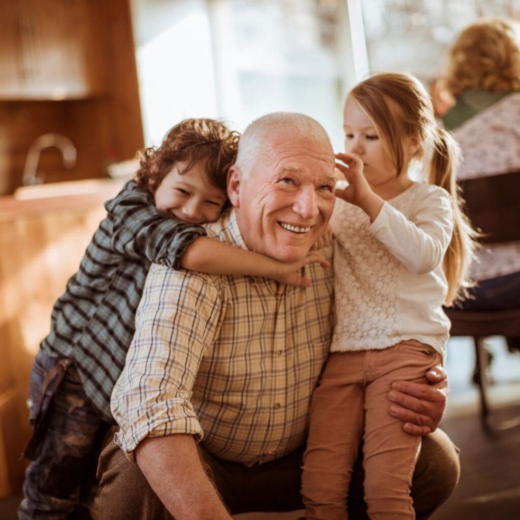 Centre for Sight grandfather with grandchildren young boy and girl smiling after cataract surgery stock image