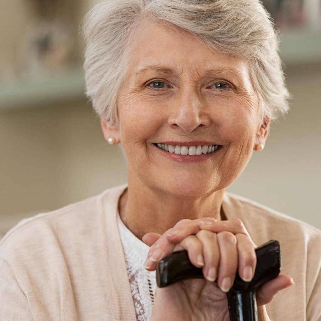 How Cataract Surgery Reduces Fall Risk in Older Adults 5 Centre for Sight risk of falls with cataracts elderly lady with walking stick smiling at camera grey hair stock image|Centre for Sight elderly patients sitting on a bench in a park outside grey hair cuddling jeans and a jumper elderly couple male female