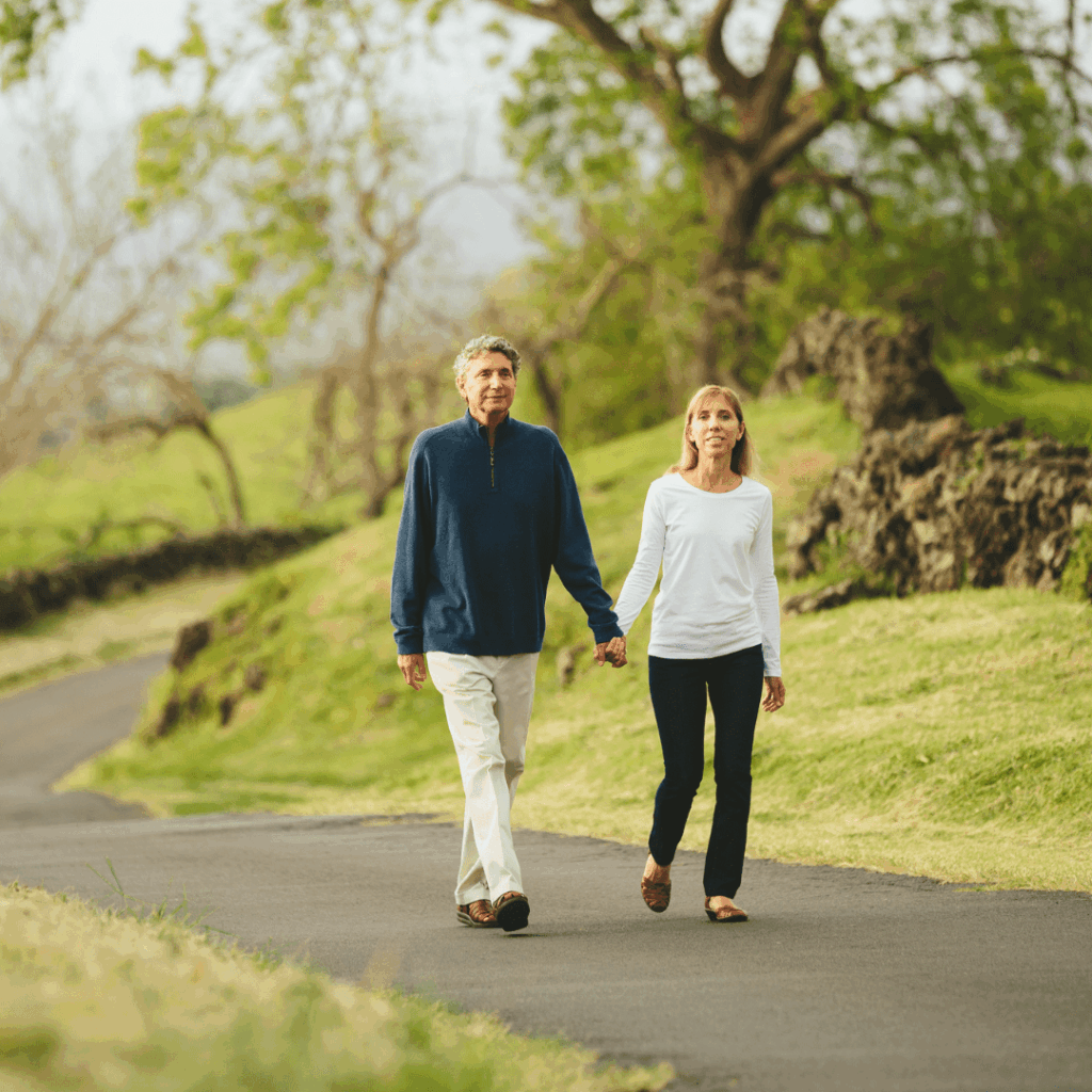 Exploring RLE vs. Phakic IOLs 8 Middle aged couple walking through woods on road holding hands